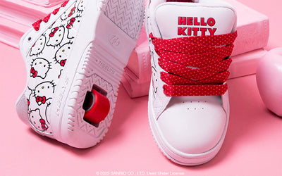White sneakers with Hello Kitty design on a pink background