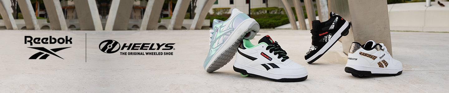 Three pairs of children's shoes from Reebok and Heelys on a white background with brand logos.