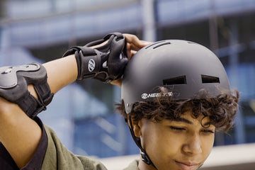 Person wearing a Heelys helmet and pads