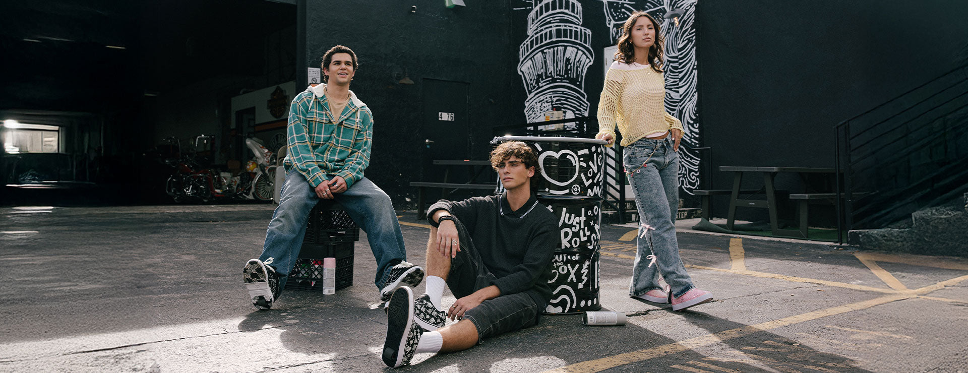 Adults Heelys roller shoes - Three people wearing Heelys for men and women, with a mural in the background